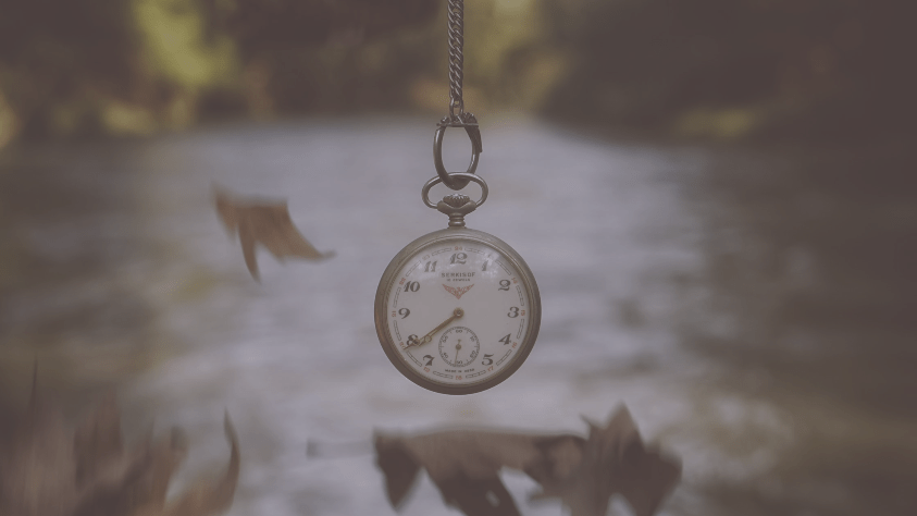 The background is a forest scene with a pocket watch hanging in the centre.