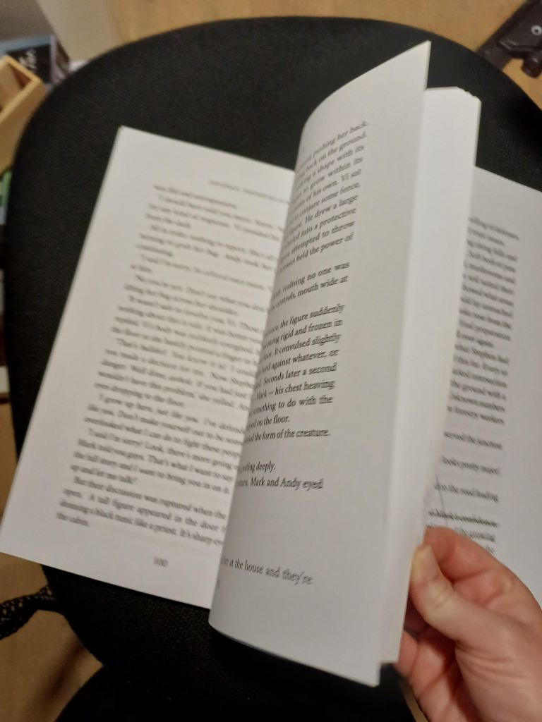 jess flicking through the pages of her manuscript